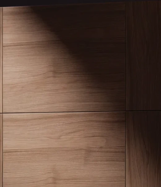Close-up of the Fabuwood Siena door face showing vertical wood grain and the tight seam where two frameless doors meet