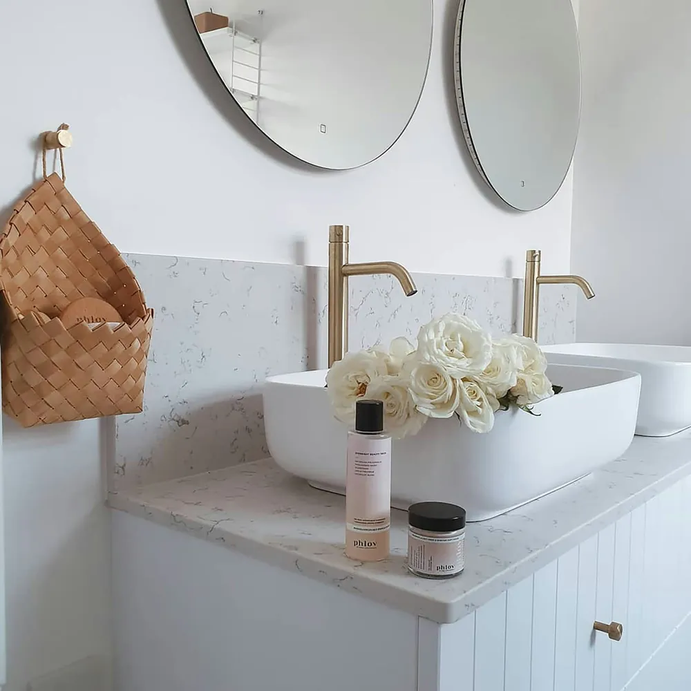 Lyra Silestone quartz with brass hardware