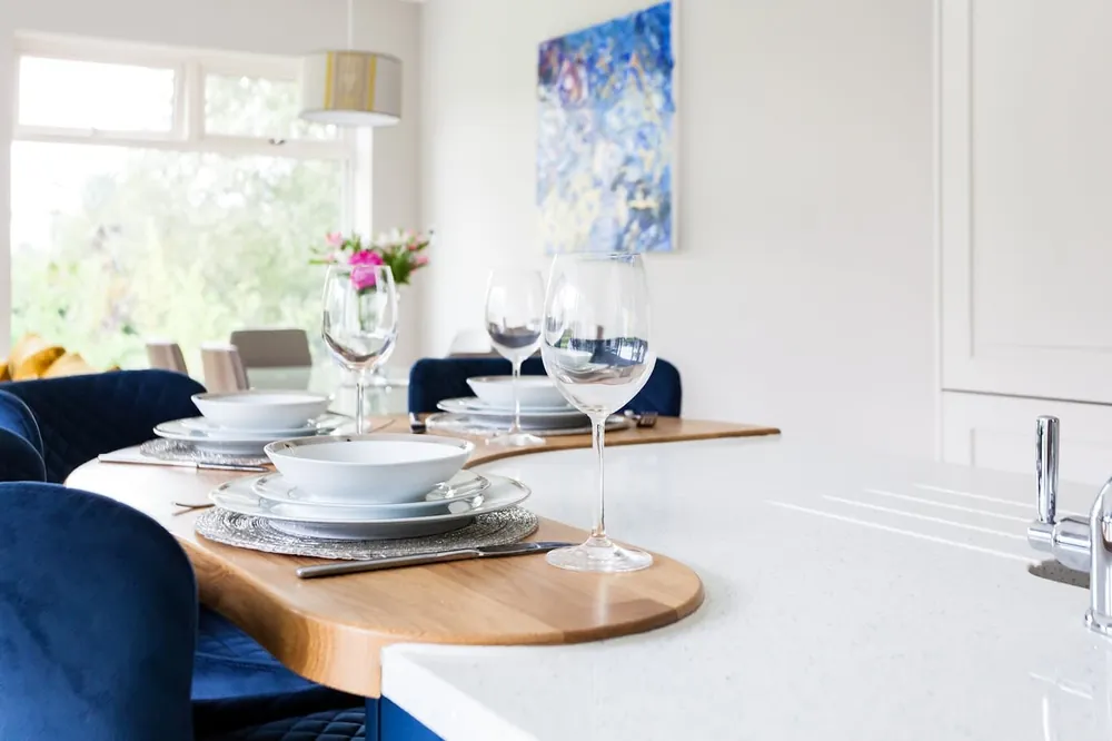 Stellar Snow Silestone quartz with brass hardware