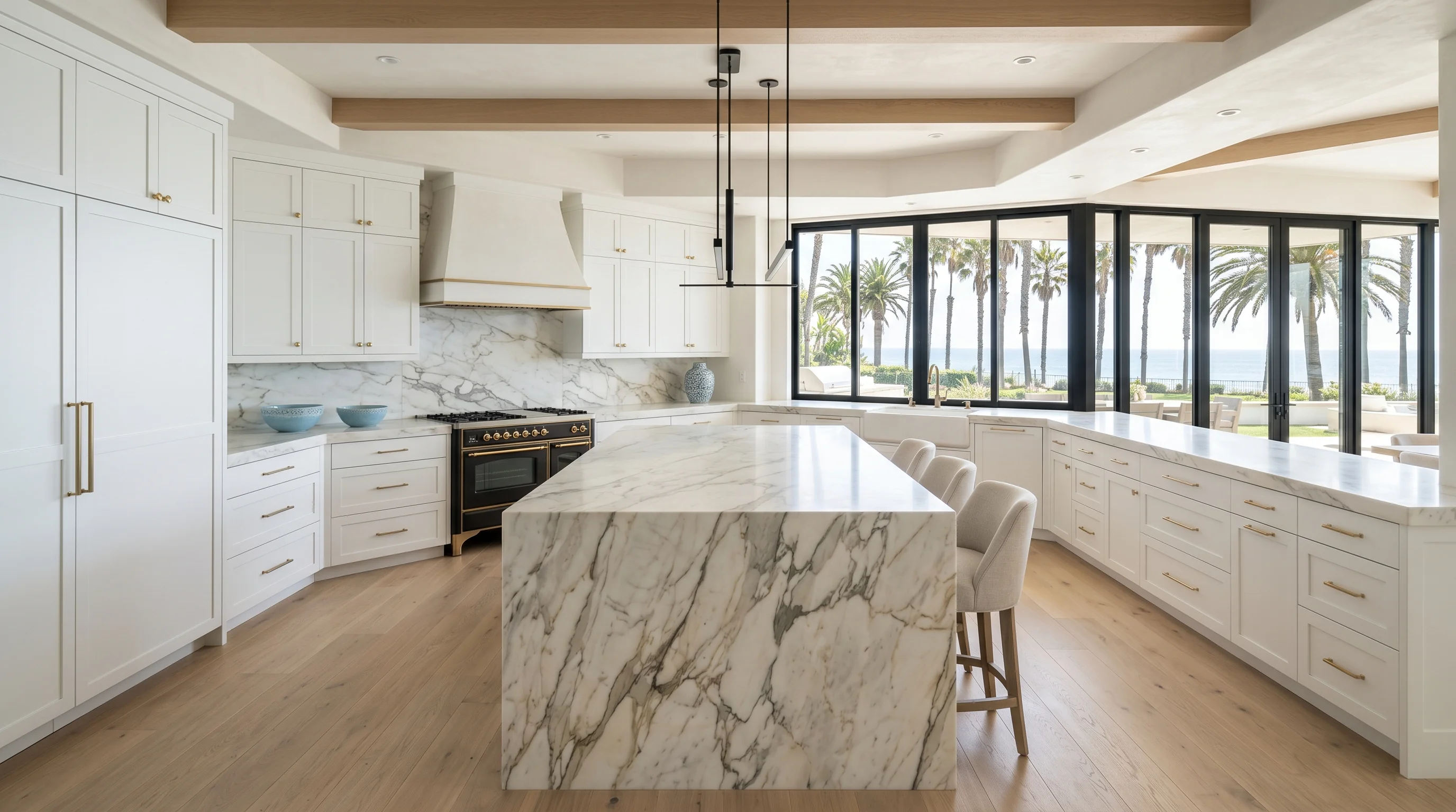 Panoramic finished Delray Beach kitchen with marble island and brass hardware