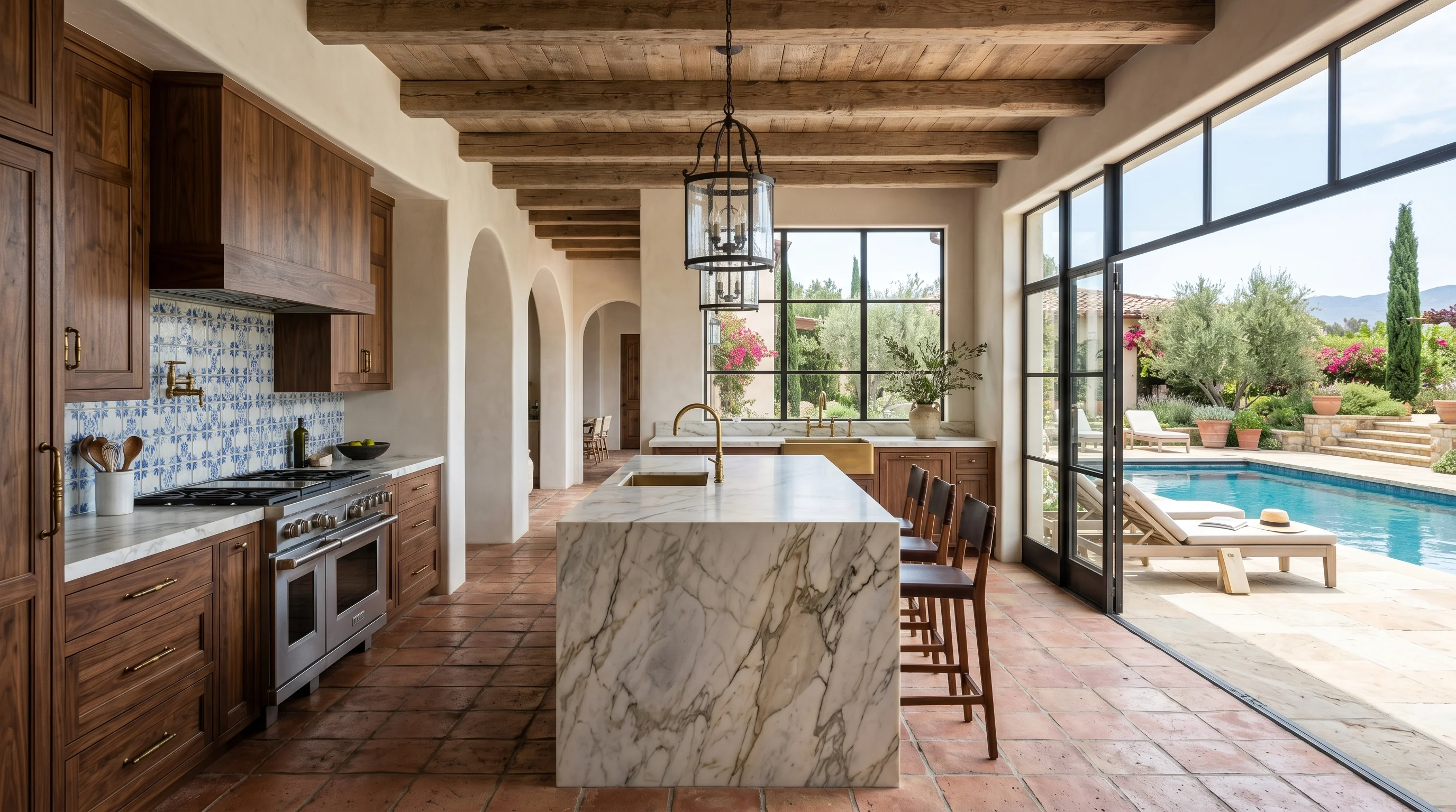 Ultra-wide Lake Worth kitchen with marble waterfall island and pool deck view