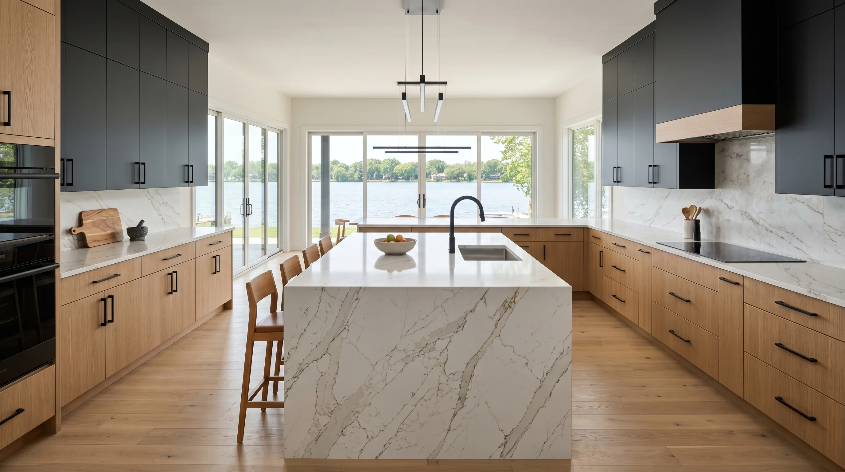 Panoramic finished Westlake kitchen with marble island and brass hardware