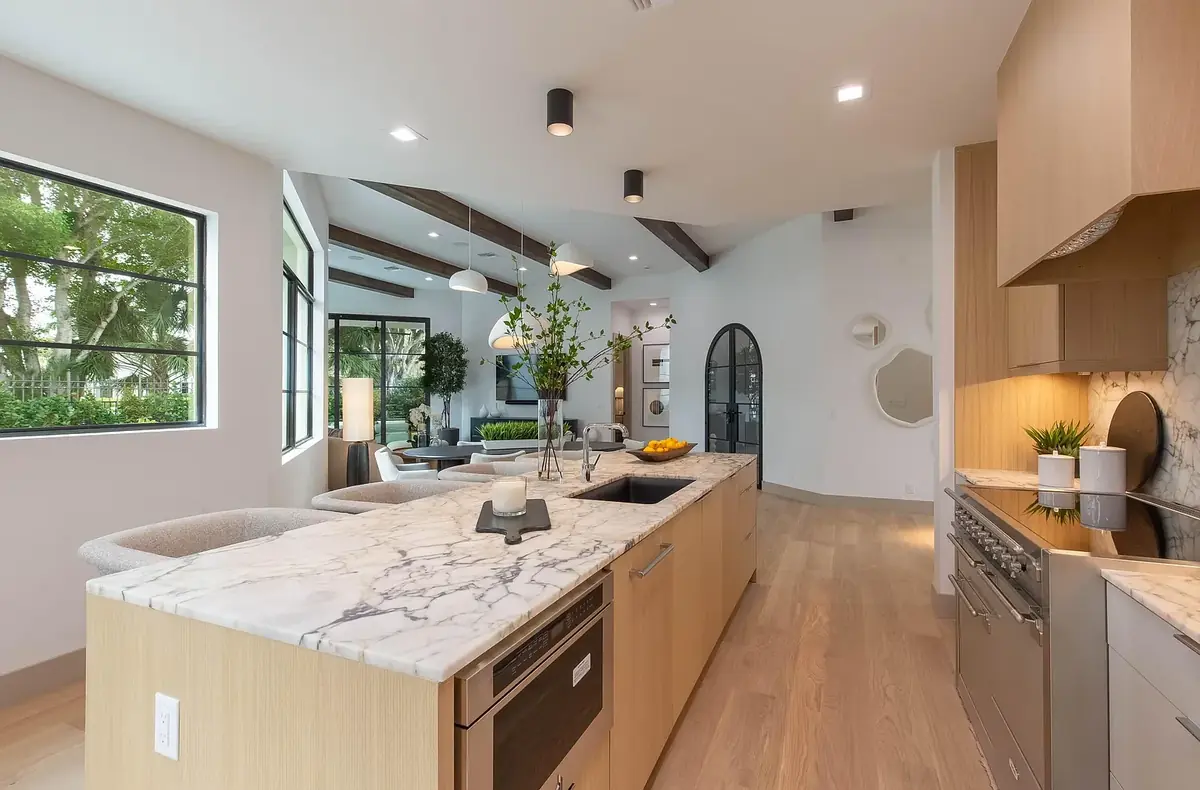 Luxury kitchen remodel with marble island and custom cabinetry in Palm Beach County by South Florida Kitchen and Bath Design